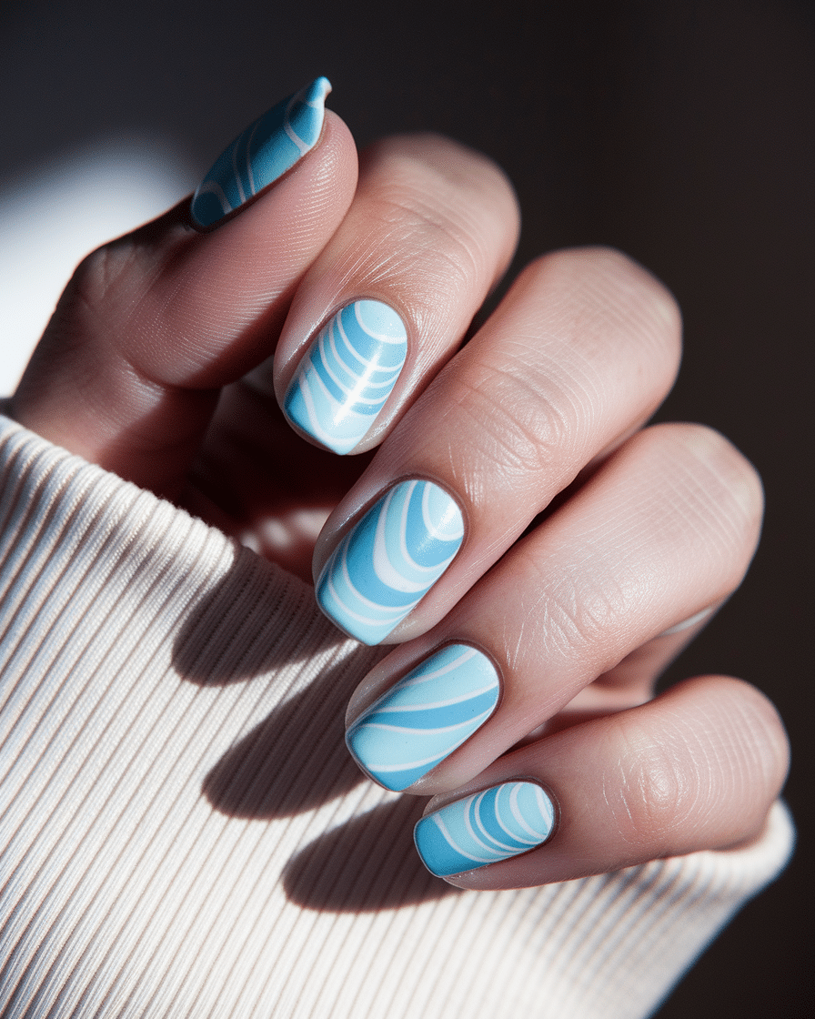 0020_2_a-close-up-photograph-of-a-beautiful-han_fzgp-uwORUyrMckzILpFYA_TZYHSkBFQc-E7mU7CBvhag_cover Light Blue Nail Designs for a Soft and Timeless Manicure Look