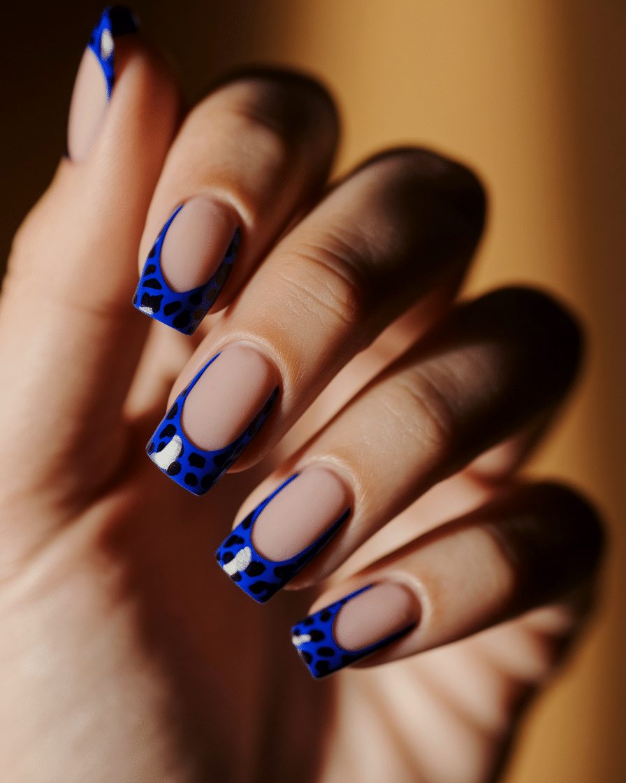 0005_1_a-close-up-photograph-of-a-beautiful-han_3PE__PozTnaWkQ11YjyyLQ_pU6xKn3iSDaANBJ0qwf8hA_cover Bold and Stylish Animal Print Nails: How Blue Leopard Designs Are Taking Over