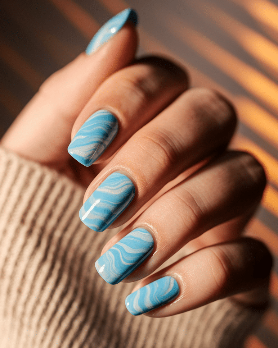 0007_1_a-close-up-photograph-of-a-hand-with-nai_KhdFE6YQRUWqfg5SPVM3Vw_acZVthG1RG6n18bb3CONzw_cover The Ultimate Guide to Blue Nail Designs That Always Stay in Style