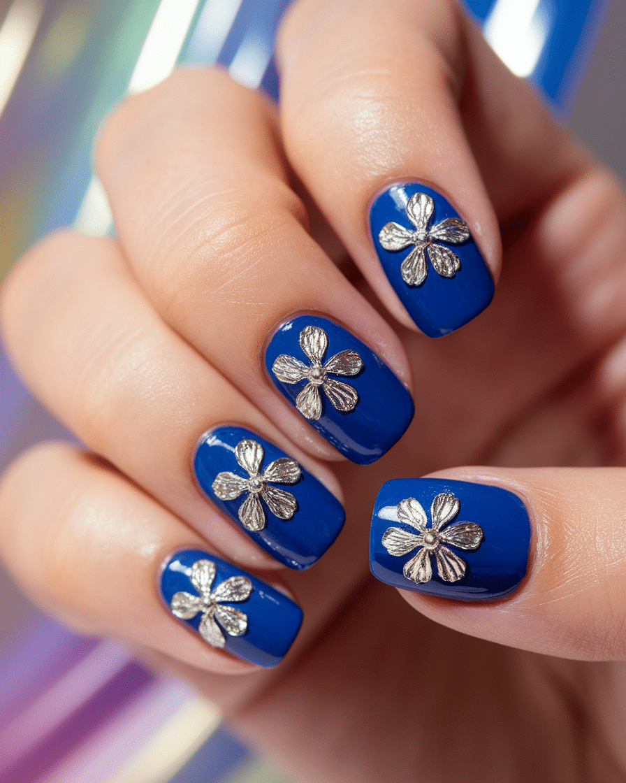 0003_1_a-close-up-photograph-of-a-hand-with-bol_J9MtcFRrQWecJwIiPXoC1A_PquWSLgkSUyZ7rz8MV0U1A Elegant Floral Nail Designs in Blue for a Modern and Fresh Manicure